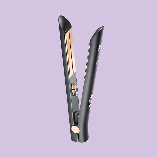 Black infrared flat iron, a plate measuring one  inches with rose gold color plate, elegant details, on light purple background