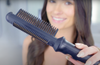 woman-holding-glider-pro-heated-styling-comb